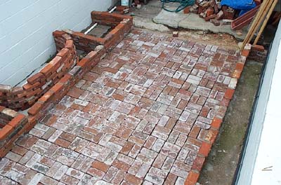 from the top of the back wall, looking up towards the house.