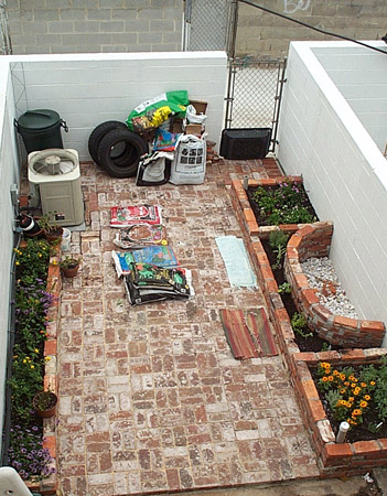 There's lavender and zinnias in the foreground, herbs in the middle, and lantana at the far end.