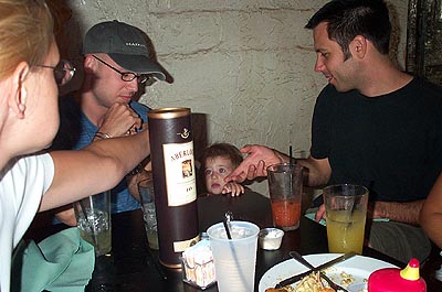 Gracie makes a break for the booze. I think Matt is describing how to open the bottle to her.