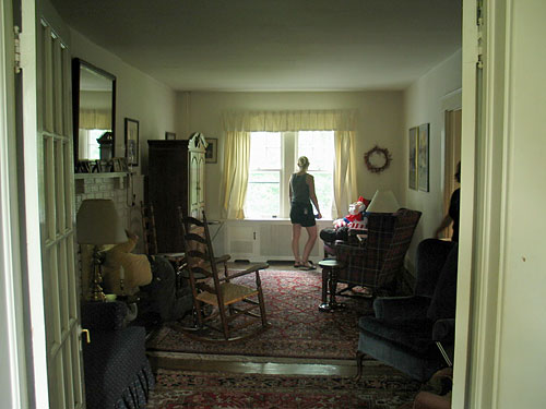 From the middle of the reception room, looking to the back of the house. On the left is the fireplace.