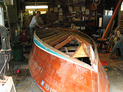 This is a gorgeous wooden Chris-Craft that my parents' neighbor owns. He's in the middle of re-hulling it for the Fourth of July.